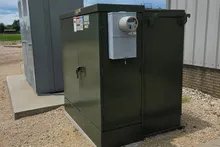 Pad-mounted transformer and switchgear at an industrial facility.